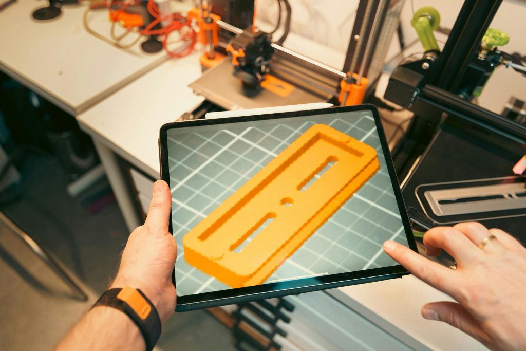 3D printer making a vehicle part, showing innovative transportation tech.