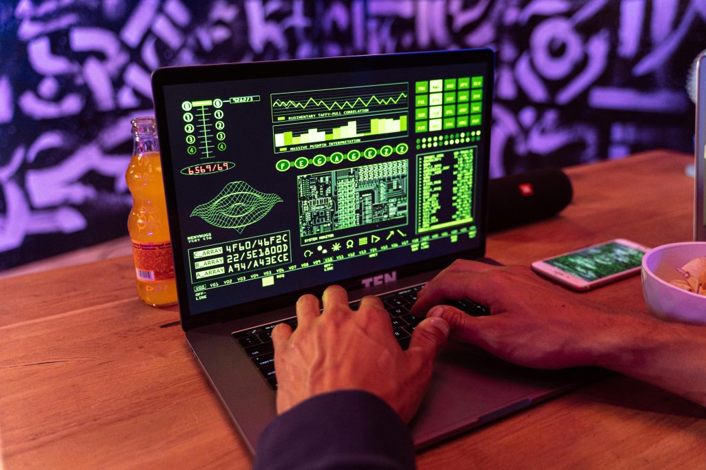 Someone typing on a laptop with a glowing lock symbol, showing cybersecurity and keeping data safe