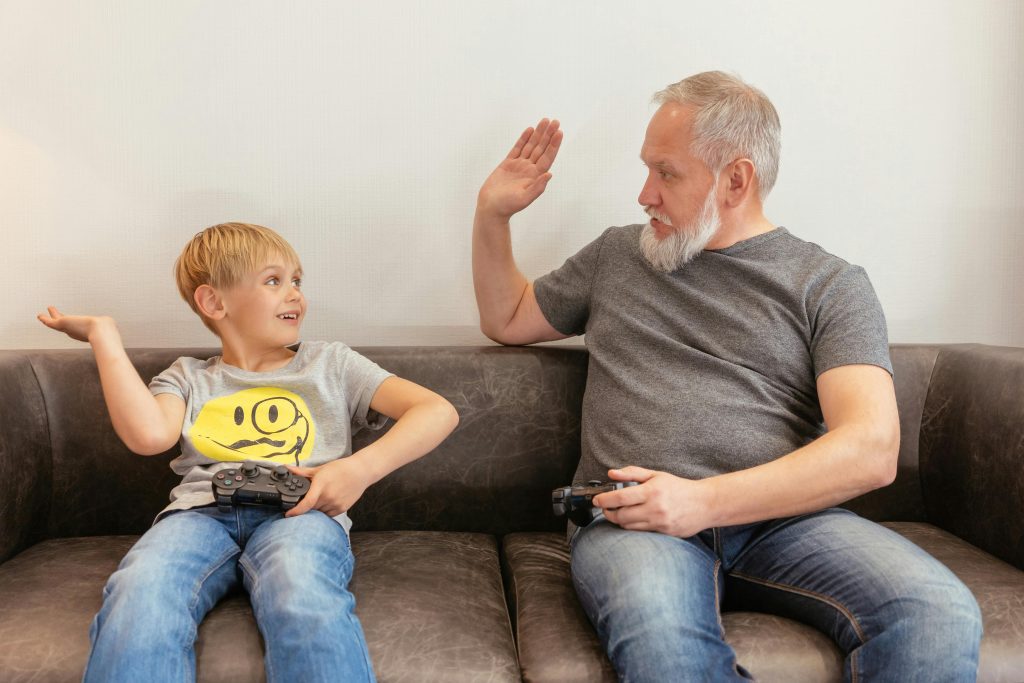 Father and son celebrating their gaming rewards