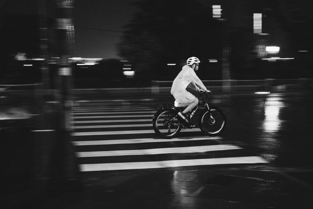 Lit bike lane in a city at night, showing smart bike lane tech.