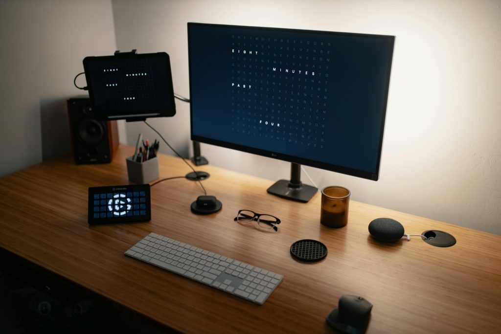 A smart speaker on a work desk, helping manage schedules and tasks.